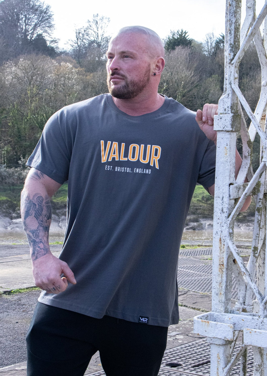 man wearing dark grey valour shirt