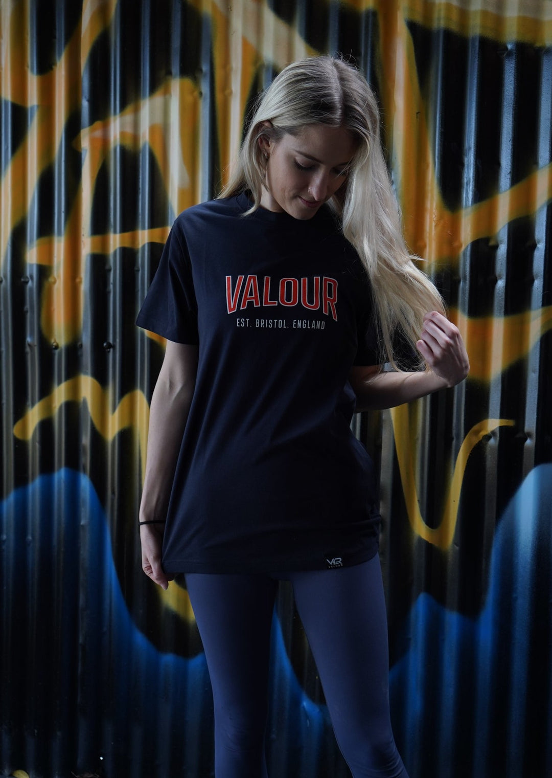 woman wearing navy valour gym shirt