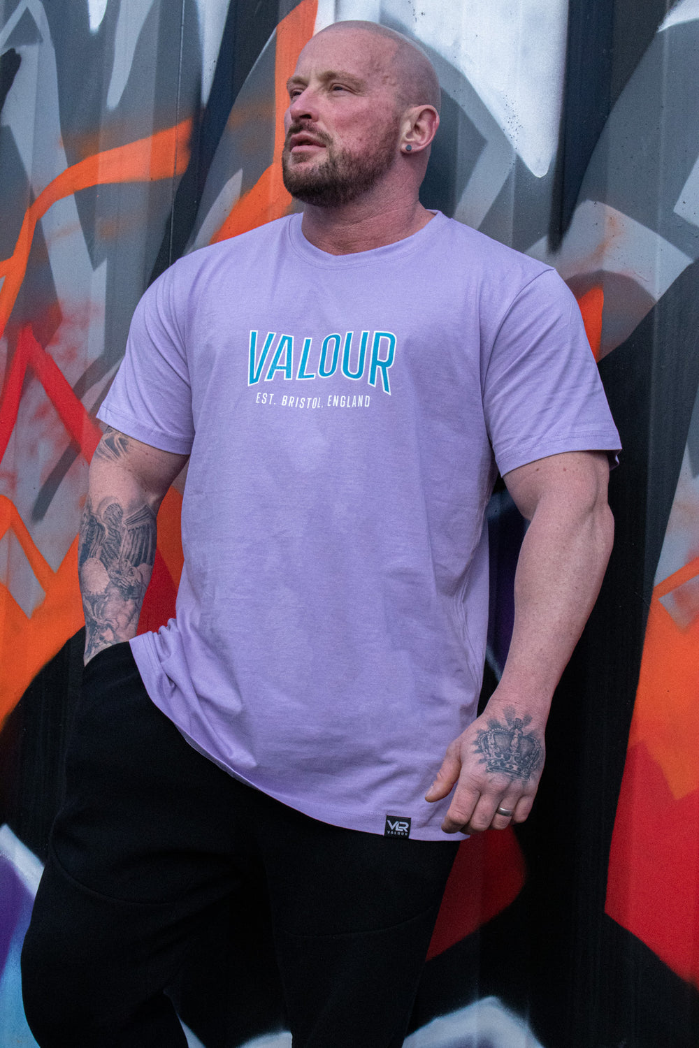 man wearing purple valour gym shirt