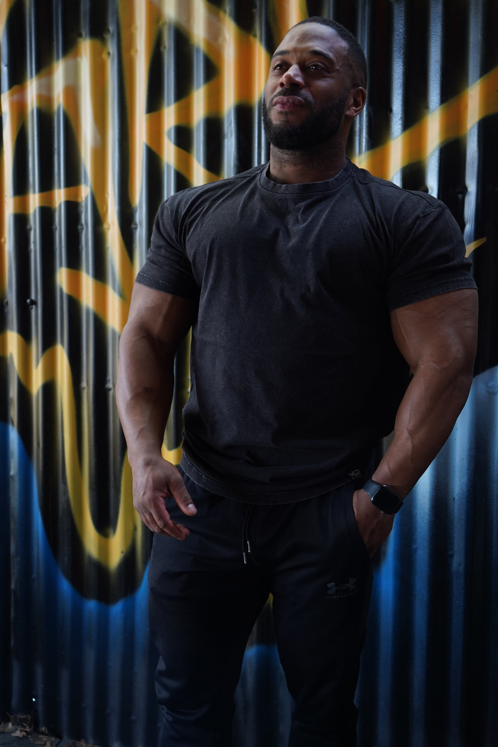 muscular man wearing black valour gym shirt