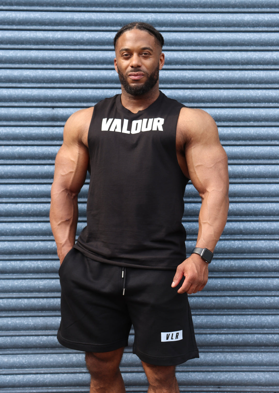 bodybuilder in black valour shorts