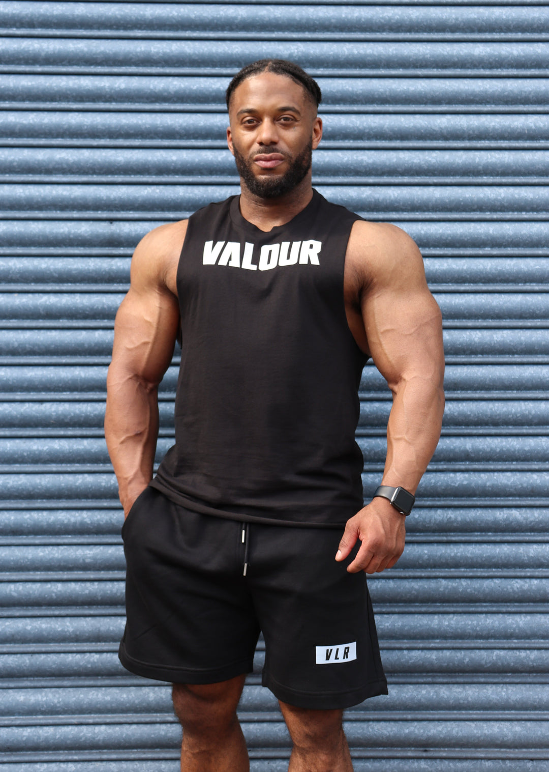 bodybuilder in black valour shorts