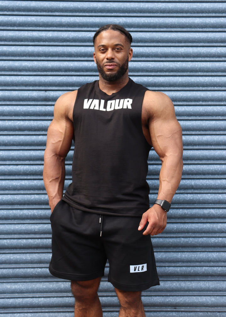 bodybuilder in black valour shorts