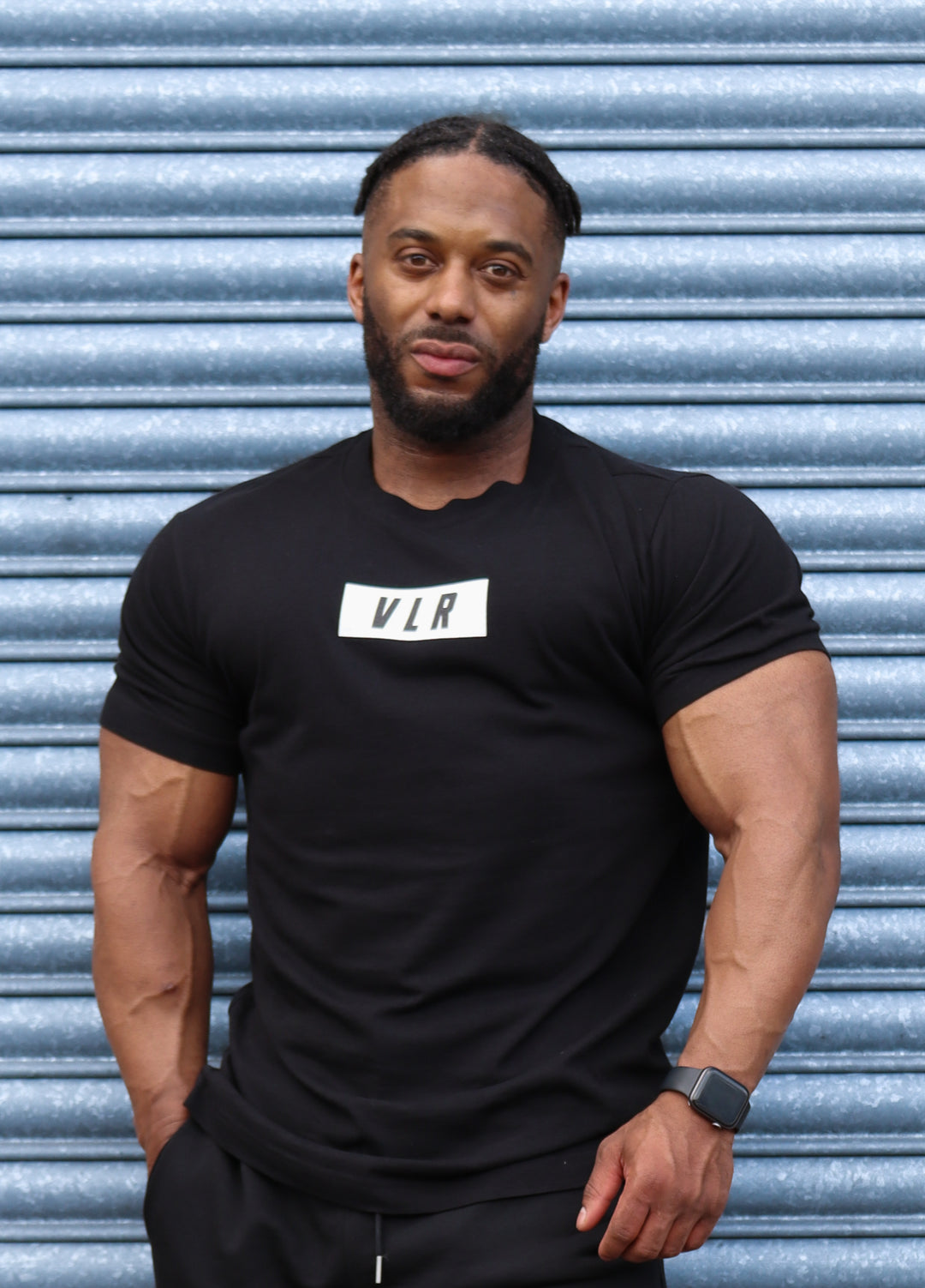 bodybuilder in black valour shirt