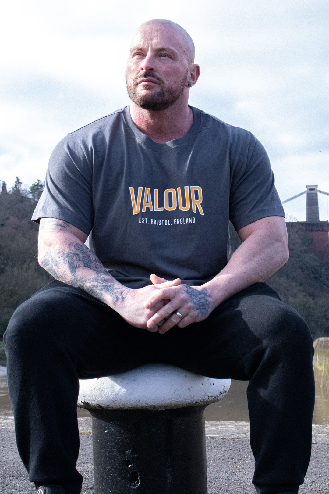 man wearing dark grey valour shirt