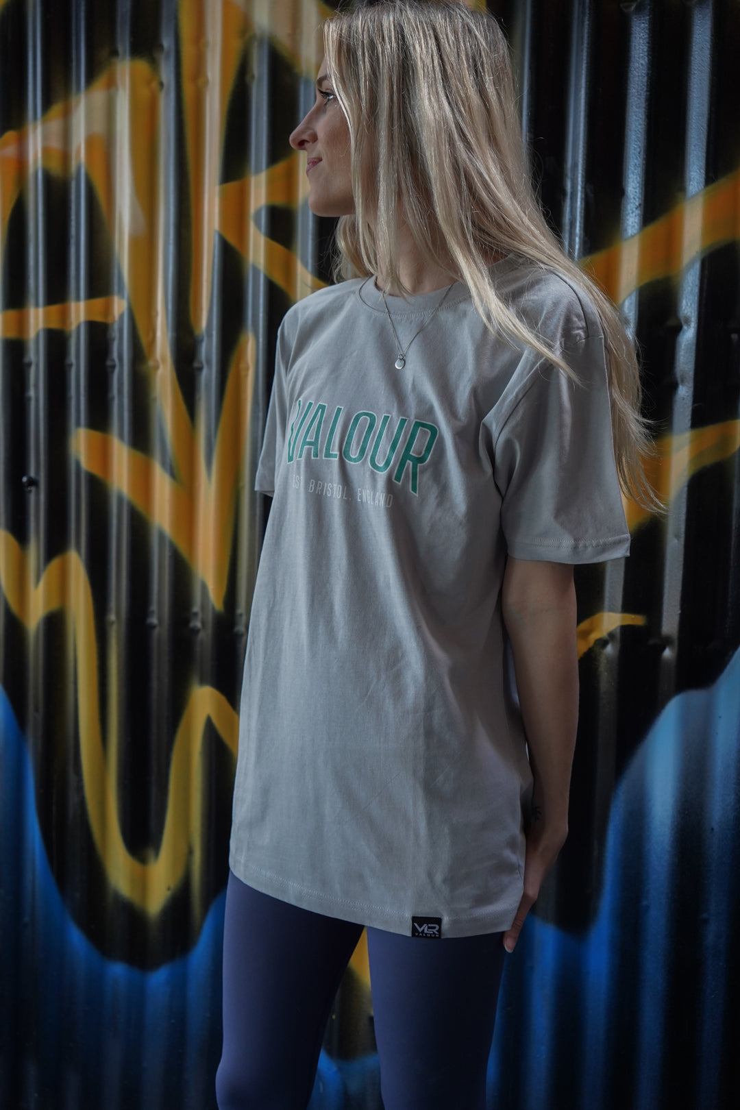 woman wearing light grey valour gym shirt